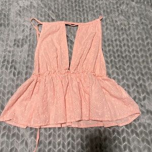 It’s a size small, pink, tie around shirt